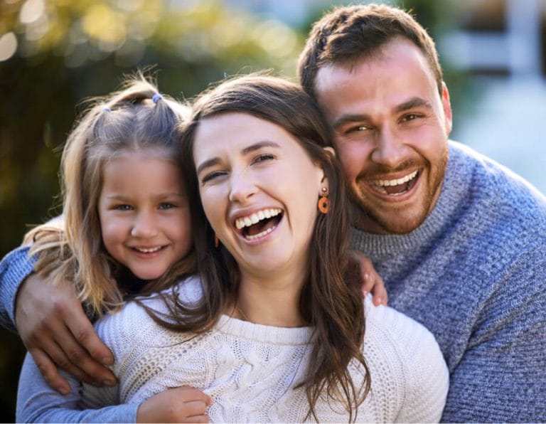 A parent and child arriving for a check up at a family dentist in Geelong